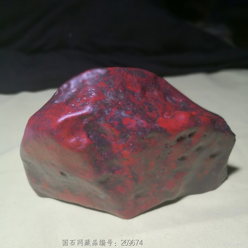 鸡血红伊丁手把件